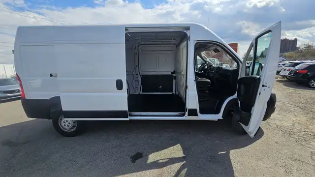 This Cargo Van powered by a Gasoline engine featuring FWD/Front- - Photo 9