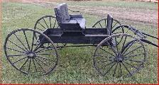 A Single Horse Drawn Buggy.