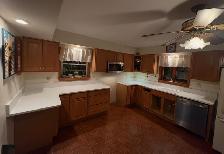 Plain White Countertops With Orange Island 437-522-8447