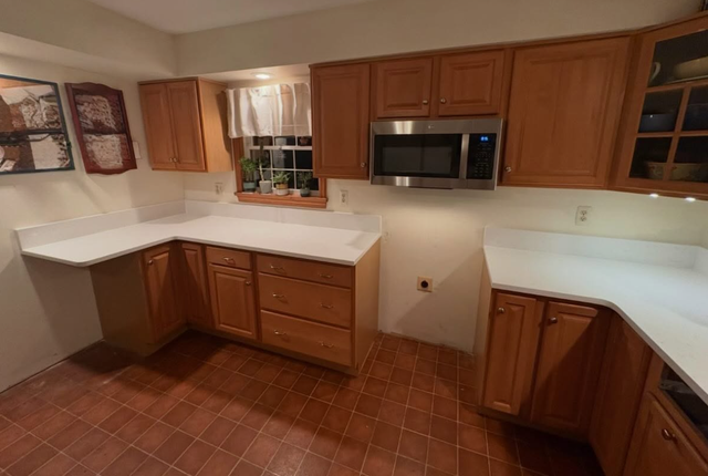 Plain White Countertops With Orange Island 437-522-8447 - Photo 2