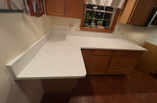 Plain White Countertops With Orange Island 437-522-8447 - Photo 4