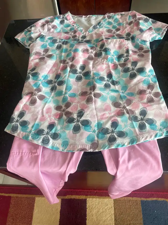 Three sets of medical scrubs in good condition!