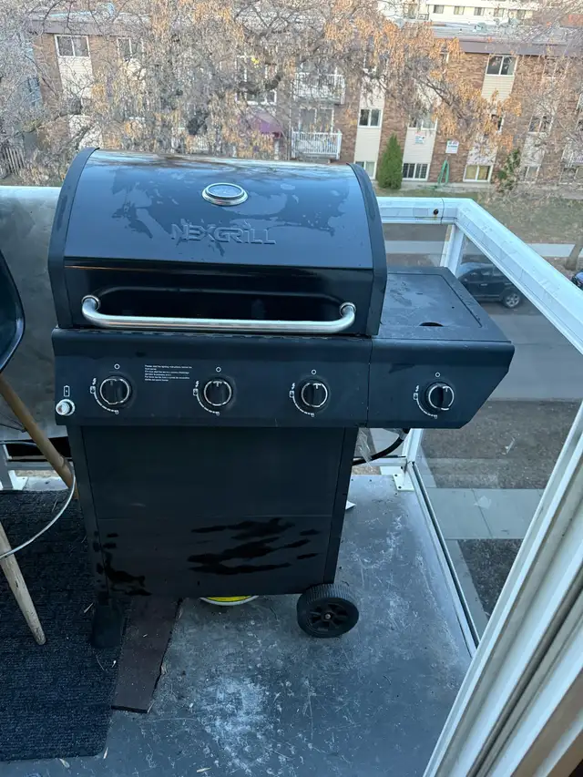 Nexgrill 3-Burner Propane BBQ Grill in Black - and propane tank