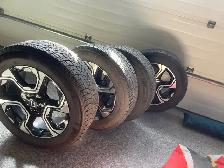 Michelin X Ice winter tires with rims.