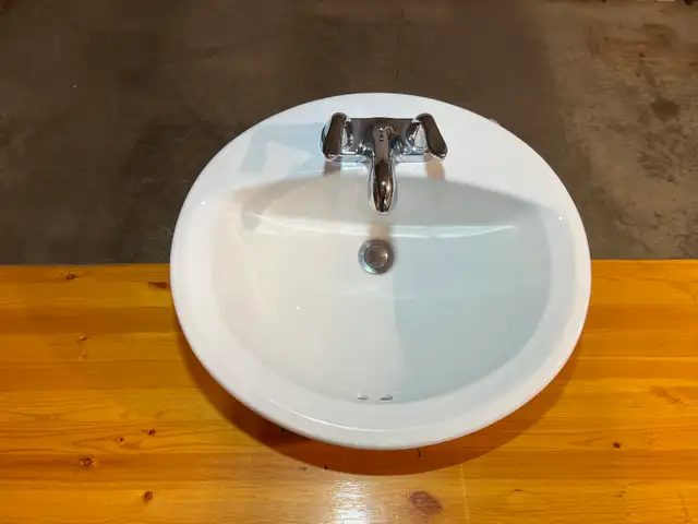 Bathroom sink with taps and faucet