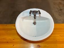 Bathroom sink with taps and faucet