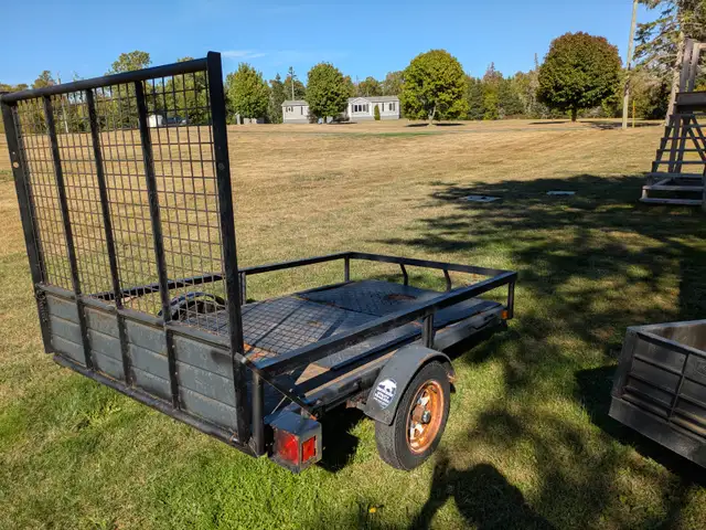 Trailer with drop down ramp