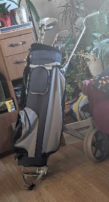 Men's golf cart and clubs.