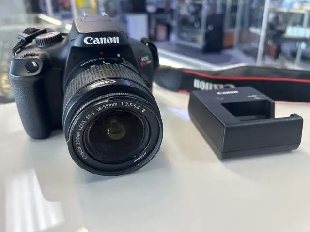 Canon T100 DSLR Camera with 18-55 lens and charger
