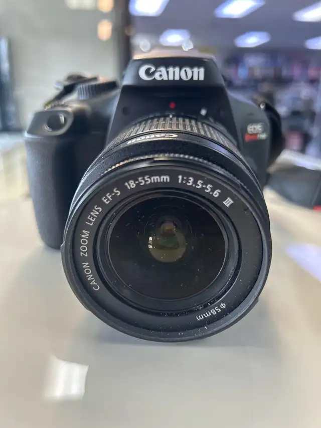 Canon T100 DSLR Camera with 18-55 lens and charger - Photo 2