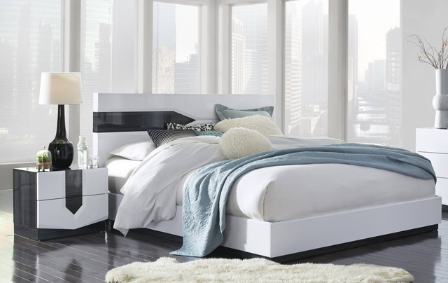 White low-profile platform bed with 2 nightstands and 2 lamps