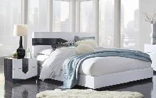 White low-profile platform bed with 2 nightstands and 2 lamps
