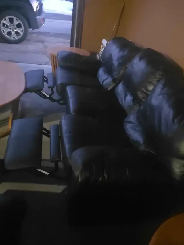 Used black leather recliner set. Free delivery & sofa disposal