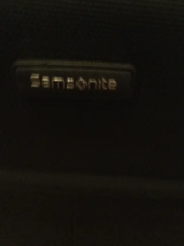 BLACK SAMSONITE SUITCASE