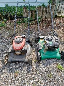 Two lawnmowers. Honda and Briggs and Stratton