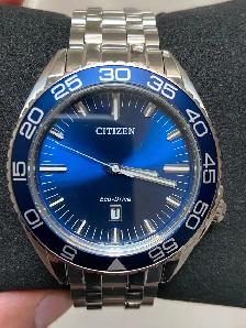 Brand new men’s Citizen Eco Drive blue dial 42 mm. $300.
