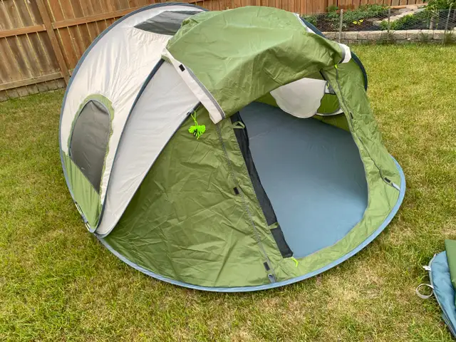 New, never used, 4 person Moon Lense Easy Pop-up Tent