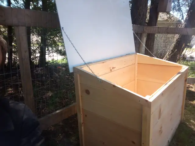 Wooden, storage, and garbage bins.