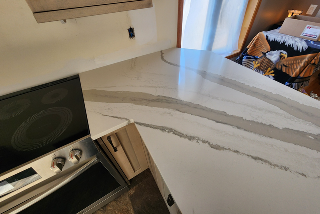 White Countertop With Stylish Golden Blackish Veins 437-522-8447 - Photo 3
