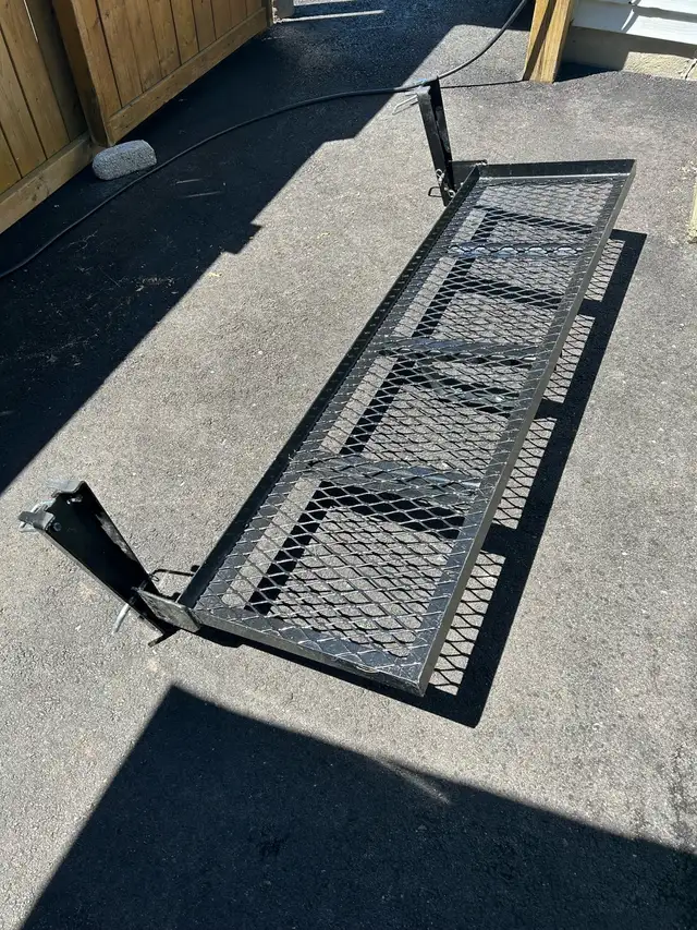 Folding tailgate storage rack. - Photo 5