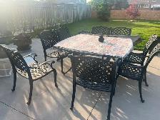 8 seats wrought iron patio table with seat cushions  …… $700.00