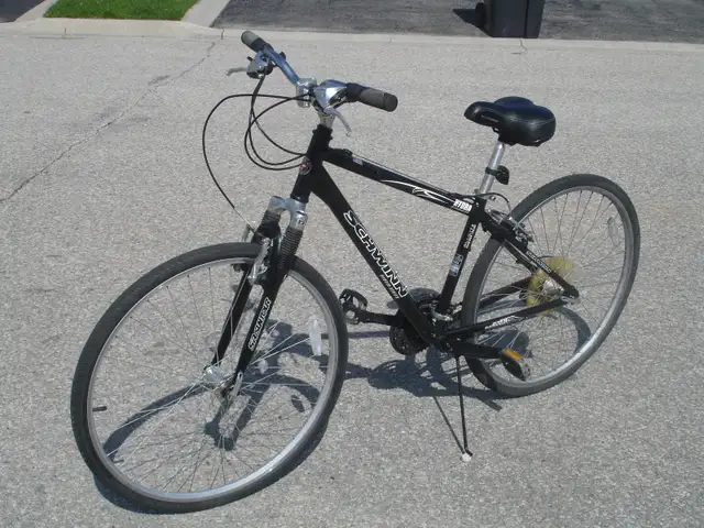 BARELY USED 700C SCHWINN HYBRID SERIES 24 SPD WITH SUSPENSION! - Photo 2
