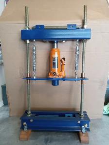 Hydraulic shop press (bench top) with 6-ton bottle jack.