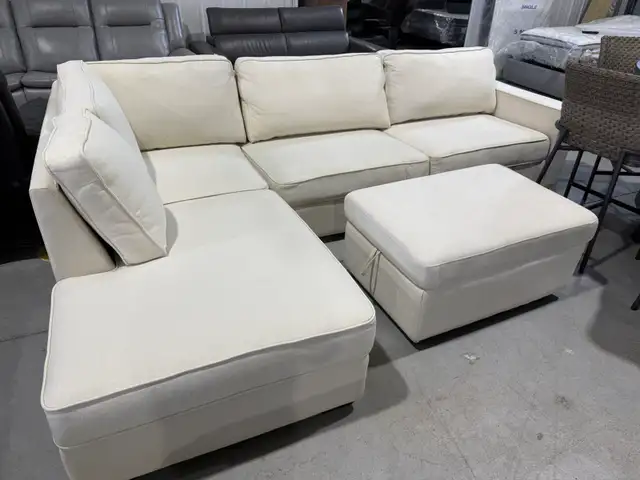Cream fabric sectional with ottoman