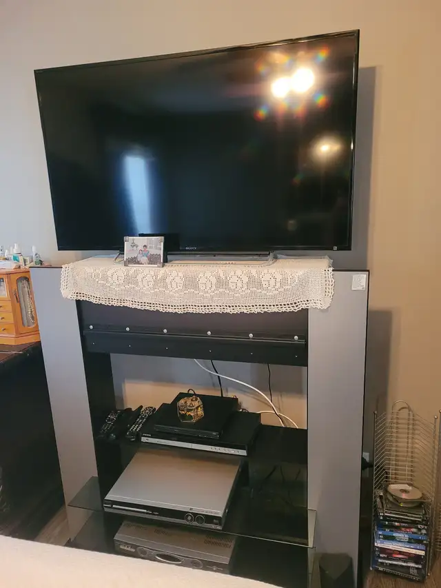 43’ Toshiba TV and TV stand.