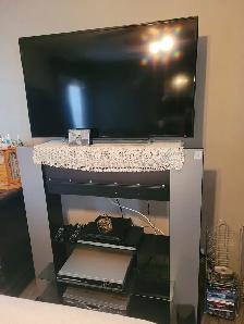 43’ Toshiba TV and TV stand.