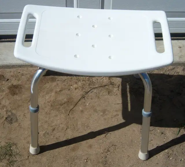 TWO BATH TUB SEATS