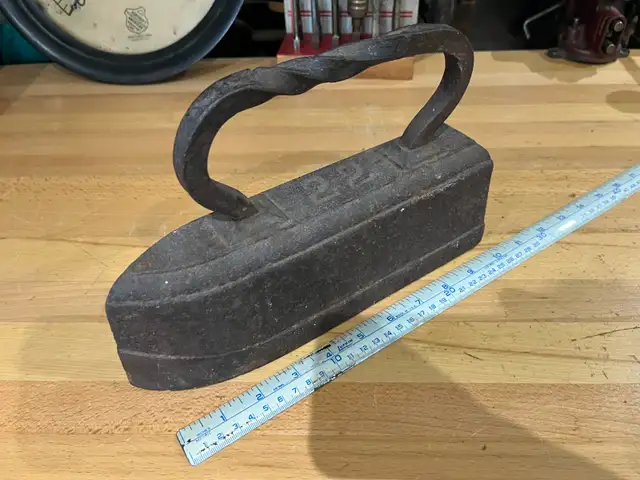 Antique heavy solid cast Iron #22 iron, weighs 22 lbs.