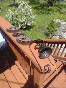 2 sad irons one handle and metal bell