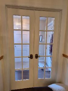White wooden folding doors, glass doors & swinging doors