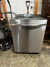 Stainless steel Whirlpool fridge and Samsung dishwasher