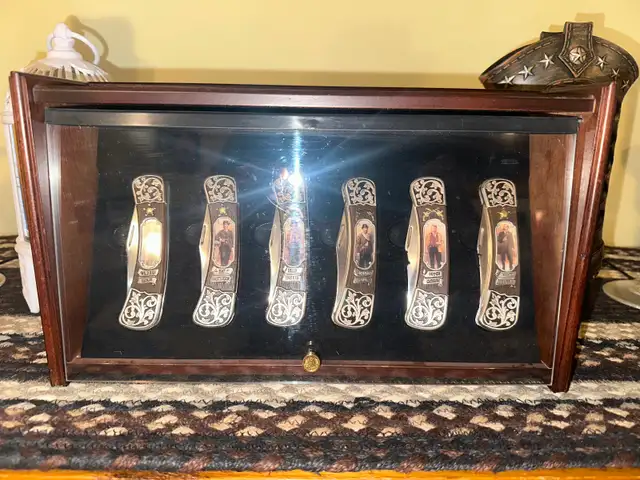 Thomas Kinkade antique western knifes .