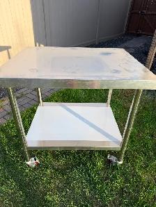 30x36 portable Stainless steel work prep table on castor wheels.