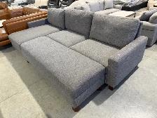 Grey fabric sectional with storage ottoman - Photo 3