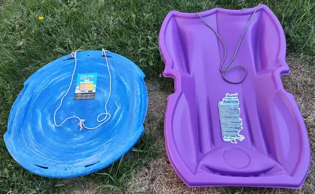 Two kids' snow sleds.