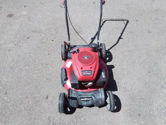 MUST SELL NEED GONE A POWERSMART LAWN MOWER ASKING $120.00 OBO