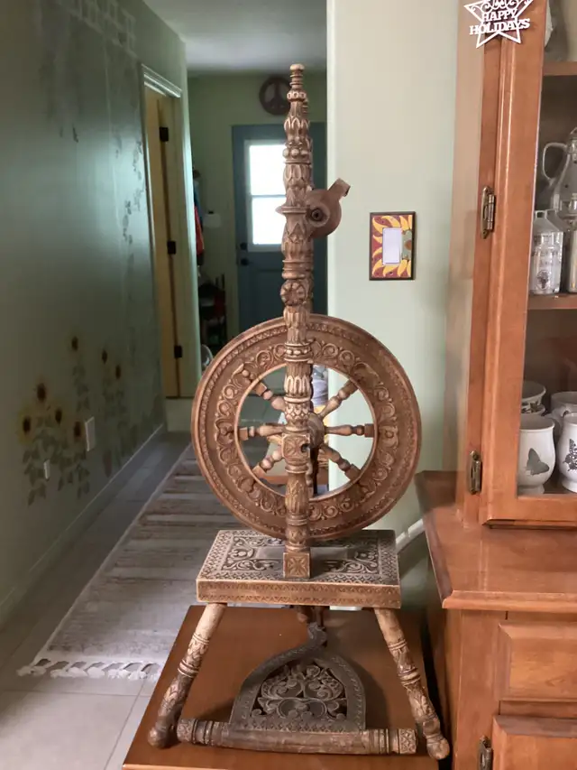 Hand carved spinning wheel
