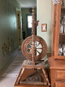 Hand carved spinning wheel