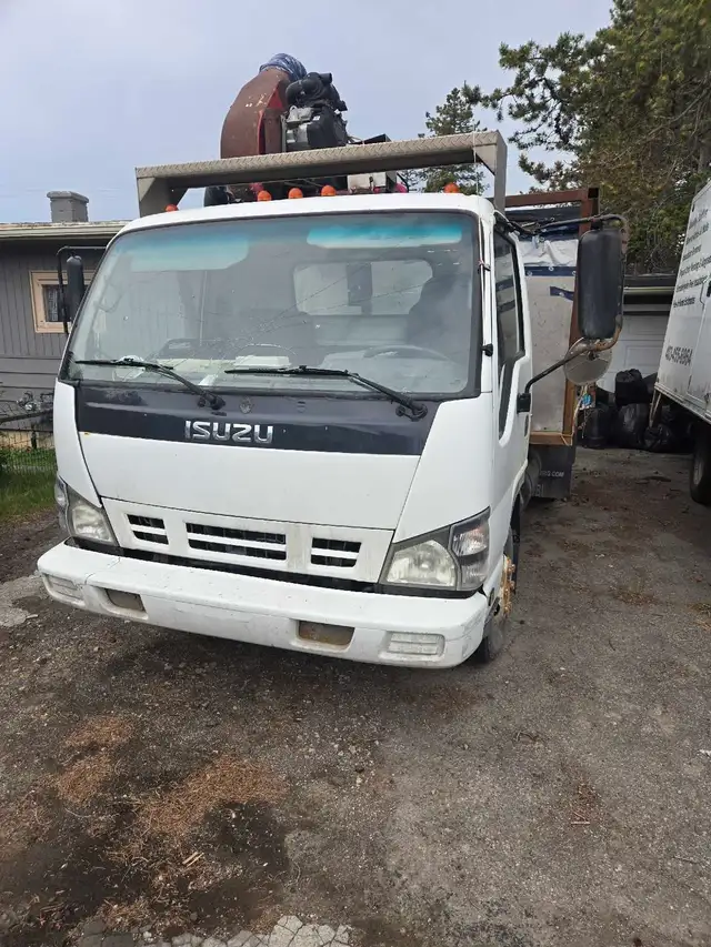 2006 ISUZU dump truck with vac unit.
