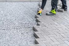 Concrete repairs and pavers installed - Photo 5