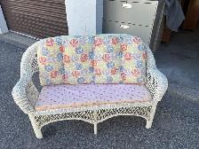 Free delivery used White Wicker Loveseat with Floral Cushions
