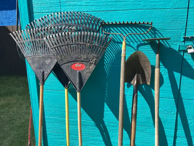 Assorted garden tools, snow shovels