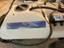 sprayer poles behind ATV or garden lawnmower