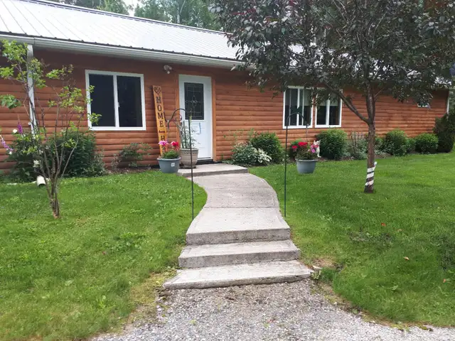 Off Grid home on year round road.