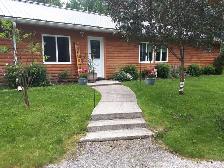 Off Grid home on year round road.