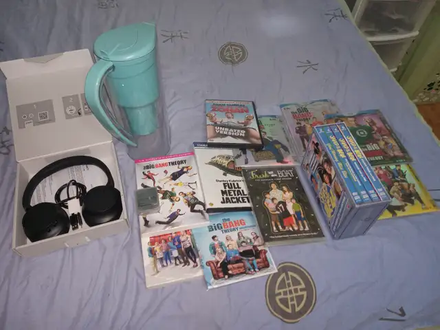 Miscellenious items music player headphone ties dvds swim masks